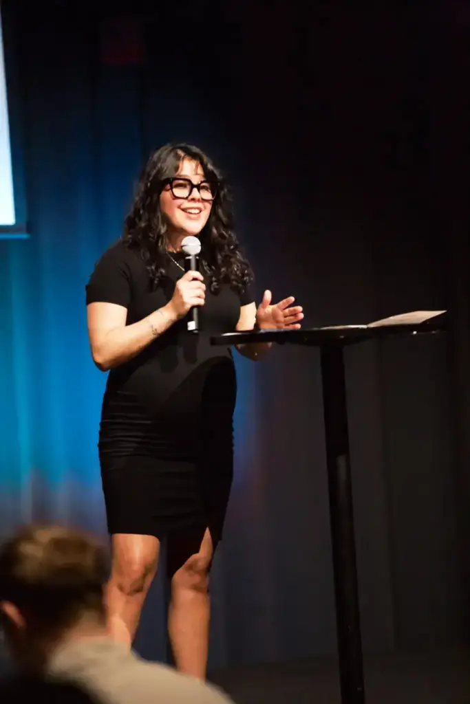 A Pillar Church speaker smiling while sharing a message
